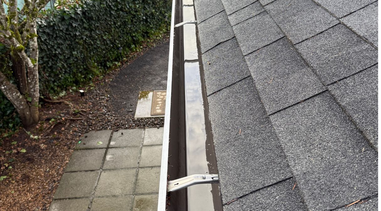 Cleaned gutter channel after leaves and debris have been removed