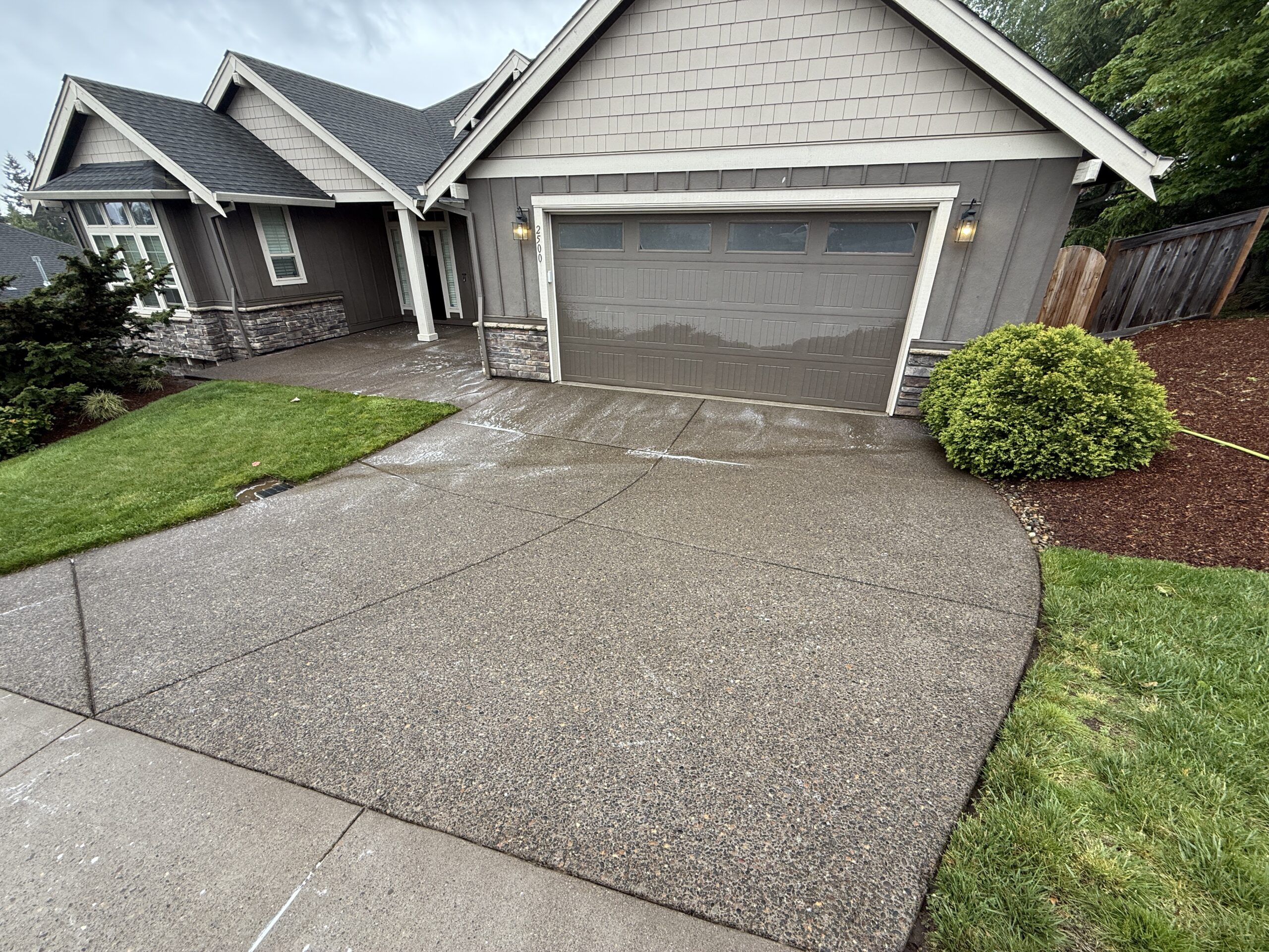 Concrete driveway pressure washing by Orbit Soft Wash serving West Linn, Oregon